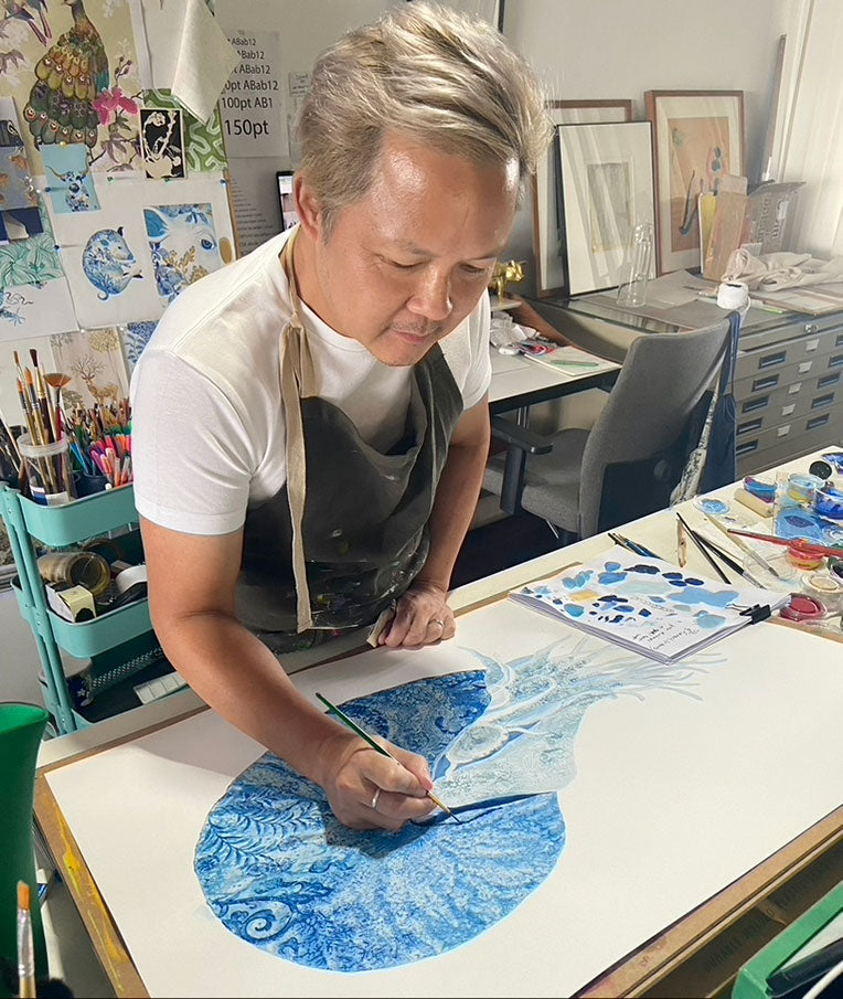 Artist Chris Chun painting a Nautilus