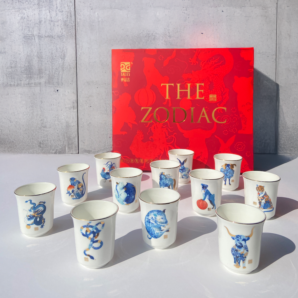 Elegant set of 12 Chinese Zodiac Tea Cups with embossed designs, 24K gold highlights, and artisan craftsmanship, beautifully gift-boxed for special occasions like Lunar New Year